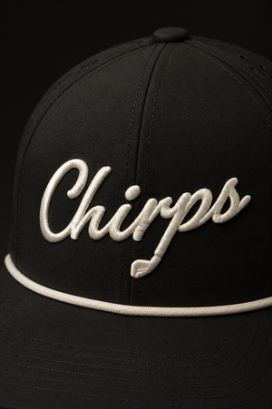 Black cap with 'Chirps' embroidered on it against a black background