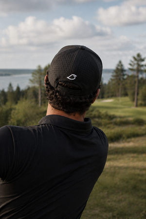 Rear view of the Chirps Performance Rope Hat in Black, showing breathable mesh and Chirps bird logo on the course